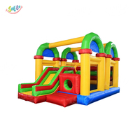 Château gonflable coloré de qualité commerciale avec toboggan et tunnel pour enfants, idéal pour la location événementielle