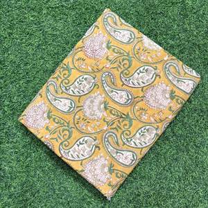 Premium mustard yellow cotton <b>fabric</b> featuring a traditional <b>Indian</b> paisley and floral hand-block print - Product Image 2