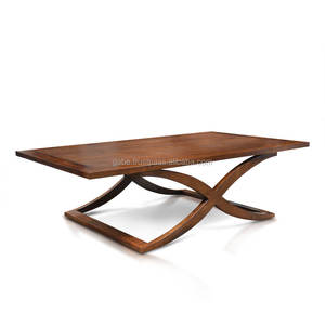 Elegant teak coffee <b>table</b> featuring sturdy cross legs, finished in a rich deep dark <b>brown</b> color, blending timeless durability - Product Image 1
