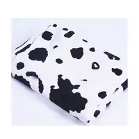 Ücretsiz örnek % 100% Polyester siyah ve beyaz hayvan kadife kanepe kılıfı inek desen baskı kumaş