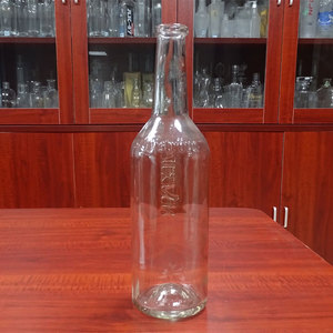 Botella de vidrio redonda de 1 litro con base con hoyuelos para <span class=keywords><strong>whisky</strong></span>, venta al por mayor de fábrica - Product Image 1