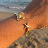 Bracelet manchette CUMAI Étoile de mer et coquillage en acier inoxydable plaqué or, ajustable, pour femme, bijoux de plage et d'océan