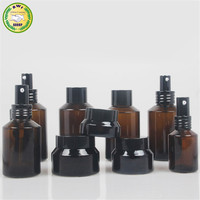 Flacon compte-gouttes en verre ambré mat noir transparent à épaule inclinée pour sérum cosmétique et huile essentielle, ensemble d'emballage avec boîte