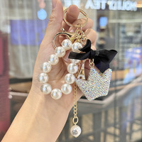 Pendentif porte-clés de luxe en forme de couronne avec perle et nœud, idéal pour téléphone, sac et clés de voiture, fabriqué en Chine