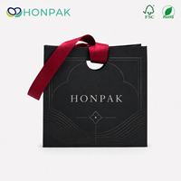 Sac shopping en papier noir de luxe personnalisé avec poignée en ruban, logo en feuille d'aluminium, emballage cadeau haut de gamme pour la marque de bijoux de mode HONPAK