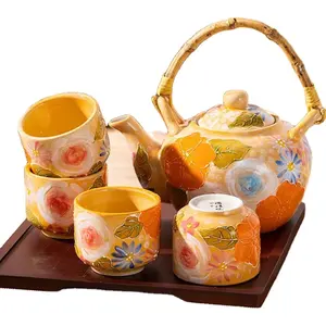 Most popular in 2024 Japanese style flower pattern ceramic teapot with bamboo handle for home and office used