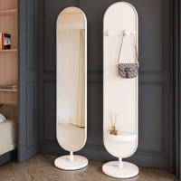 Miroir de dressing multifonctionnel rotatif moderne en métal pour chambre à coucher Miroir sur pied avec porte-manteau et porte-chapeau Miroir décoratif