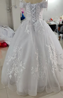 Robe de mariée de bal africaine personnalisée 2026, épaules dénudées, ornée de perles, avec appliques en dentelle blanche et jupe en tulle à manches à franges