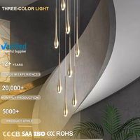 Grand lustre personnalisé en cristal au design minimaliste avec chaîne, idéal pour hôtels, maisons, escaliers et villas à plafonds hauts