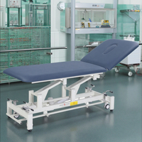 Lit de massage électrique réglable de qualité hospitalière avec fonction spa facial, structure en acier inoxydable, design pliable pour la maison, la salle de sport et le salon