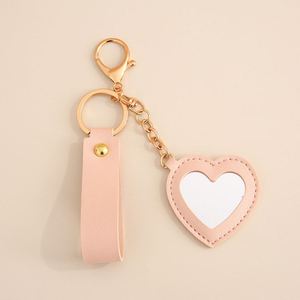 2025 Vintage Style Luxury PU <b>Leather</b> Flower Heart Bag Charm <b>Keychain</b> Creative Zinc Alloy Mirror Car Bag Pendant Keyring Gifts - Product Image 6