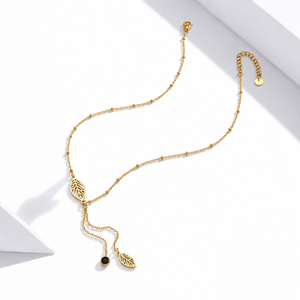 สร้อยคอแบบลาเรียต สแตนเลสสตีล ประดับเพชรคิวบิกเซอร์โคเนีย ชุบทอง 14K แบบสุญญากาศ ลายใบไม้ พร้อมลูกปัดสีดำ - Product Image 1