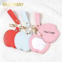 Miroir de poche tendance en forme de pomme avec logo personnalisé, porte-clés en cuir PU, miroir de maquillage compact pour femmes et filles, cadeau promotionnel