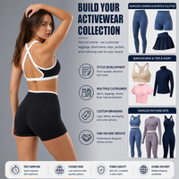 Ensemble de yoga 2 pièces noir et blanc pour femme : Soutien-gorge de sport à col halter et découpes, short cycliste taille haute – Tenue de sport et fitness