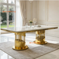 Table à manger moderne de luxe en métal avec plateau en pierre frittée marbrée et pieds en acier inoxydable créatifs pour mobilier de salle à manger d'hôtel