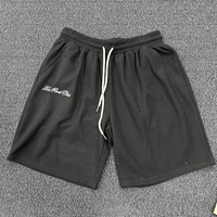 Shorts en tricot gaufré pour hommes, taille élastique, cordon de serrage contrastant blanc, poches latérales, coupe ample, longueur genou, style streetwear