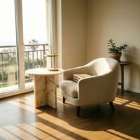 Table basse en marbre travertin beige à pieds croisés, style moderne et organique, idéale pour l'aménagement intérieur Japandi et les cafés chaleureux