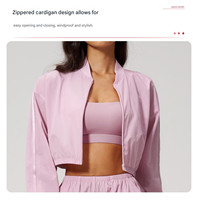 Veste Cnshell courte sans poches, entièrement zippée, coupe oversize, manches longues lanternes larges, col montant, élastique, séchage rapide