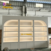 Meuble de présentation mural moderne à arche, éco-responsable, avec éclairage LED pour salon de beauté, coiffure, magasin de détail et salle d'exposition