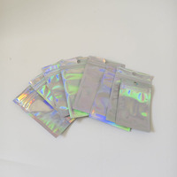 Emballage pour jouets en peluche en plastique laminé OPP, avec fermeture éclair transparente sur le devant, différentes tailles, dos holographique brillant, imprimé par gravure et film laser