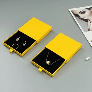 custom logo printed customized size yellow art paper box jewelry ring earrings packaging box with sponge insert and pouch