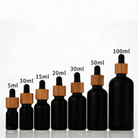 Flacons compte-gouttes en verre noir premium 15ml 30ml 50ml 100ml avec bouchons en bambou pour huiles essentielles