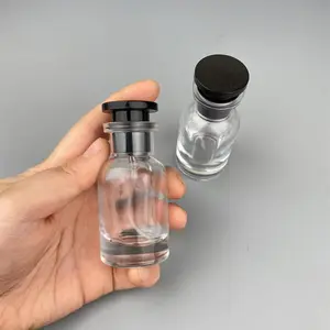Venta al por mayor logotipo personalizado 30ml 50ml 100mL botella de perfume de vidrio vacía spray botella de lujo redonda perfume