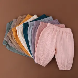 Vente en gros de pantalons d'enfants de haute qualité tissu de coton de mousseline bas quantité minimale de commande pour pantalons de bébé doux et respirants personnalisés