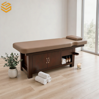Table de massage durable en cuir PU avec base en bois, étagère ouverte et repose-mains pour salon de beauté et spa