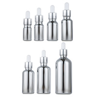 Vente en gros d'huile essentielle flacon compte-gouttes à pompe vide en or 10 ml/20 ml emballage de bouteille en verre d'huile corporelle avec couvercle à vis
