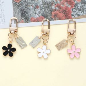 Flower Metal Keychains White Black Pink Daisy Cute Flower Keychain Accessories KeyRing Handbag <b>Key</b> <b>Rings</b> Charms Pendant Decor - Product Image 2