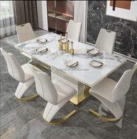 Ensemble de table à manger moderne extensible en acier inoxydable et marbre avec 6 chaises en cuir blanc