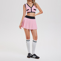 Ensemble de tennis et de golf personnalisé en gros pour femmes, haut court boutonné à col en V color-block, jupe plissée taille haute, tenue de sport d'été