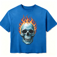 T-shirt surdimensionné bleu délavé personnalisé avec imprimé crâne et flammes, accents en strass/diamants, style streetwear américain/grunge