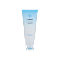 Tube cosmétique dégradé bleu mat avec tête de brosse en silicone intégrée pour nettoyant visage