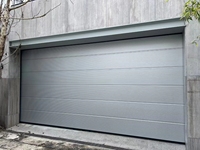 Design moderne Isolation en acier Porte de garage segmentée automatique Utilisation domestique Imperméabilisation antivol Villa résidentielle Caractéristiques