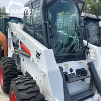 Chargeuse compacte Bobcat S220 d'occasion, capacité nominale 1035 kg, avec attaches rapides Bob-Tach pour la construction, l'agriculture et l'aménagement paysager