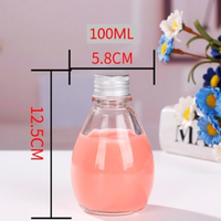 Bouteille de boisson en verre en forme de goutte d'eau avec bouchon à vis en aluminium pour l'emballage de jus, de lait, de thé et de boissons froides