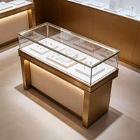 Table de présentation de bijoux de luxe moderne avec éclairage LED, construction durable en verre et bois, design facile à nettoyer pour les magasins de détail
