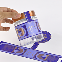 Étiquettes personnalisées avec logo, bouteille en verre bleue, rouleau adhésif, impression personnalisée imperméable pour l'emballage des produits, provenant du fabricant