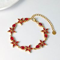 Bracelet tendance en acier inoxydable plaqué or 18 carats avec zirconiums entièrement pavés en forme de goutte d'eau et de fleur, idéal pour la vente en gros