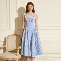 Robe Midi Femme Printemps-Été Taille Haute Coupe Évasée Sans Manches à Nœud Motif Écossais Haut de Gamme Nouvelle Collection Vente en Gros Usine