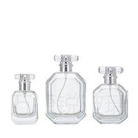 Flacons de parfum en verre transparent de luxe en forme d'hexagone avec pulvérisateur à pompe, impression sérigraphiée et couvercle en acrylique