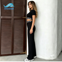 Ensemble de sport deux pièces pour femme : Legging évasé taille haute effet push-up et crop top à manches courtes – Tenue athlétique pour gym, fitness et yoga