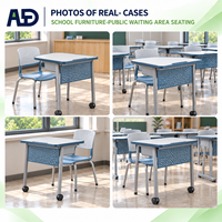 Bureau d'étudiant avec plateau en stratifié gris, panneau en acier vert, structure en acier inoxydable, mobilier de classe peu encombrant