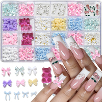 24 compartiments de décorations pour nail art : nœuds en ruban de résine, mélange de perles, ours, fleurs, strass, ornements en alliage, cerises et autres fournitures pour ongles