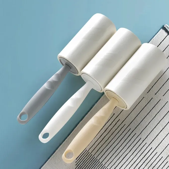 Il rullo applicatore di lanugine può strappare carta adesiva per indumenti portatili rimozione polvere di carta