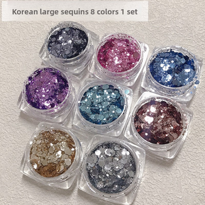 <span class=keywords><strong>ก</strong></span>ลิตเตอร์เล็บเกาหลีแบบเม็ดใหญ่ สีแชมเปญและสีน้ำเงินเข้ม ประกายระยิบระยับหลากสีสัน สำหรับตกแต่งเล็บแบบไล่เฉดสี - Product Image 1