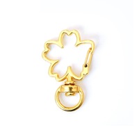 Vente Flash : Porte-clés pivotant en métal avec fermoir mousqueton, formes variées (Lune, Étoile, Fleur)