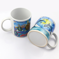 Vente en gros de tasses à café en céramique blanches et noires de 11 oz avec logo personnalisé imprimé par sublimation, souvenirs touristiques